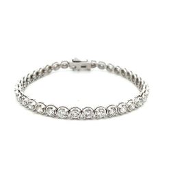 Tennis bracelet with illusion set (37) round diamonds.  D5.49ct.t.w.