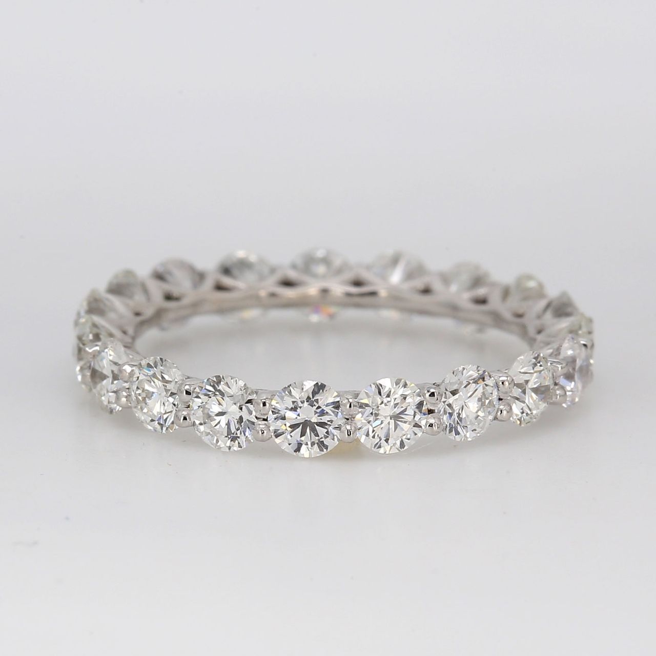 Eternity band in platinum with shared U-prong set round diamonds.  D2.30ct.t.w.  Size 6