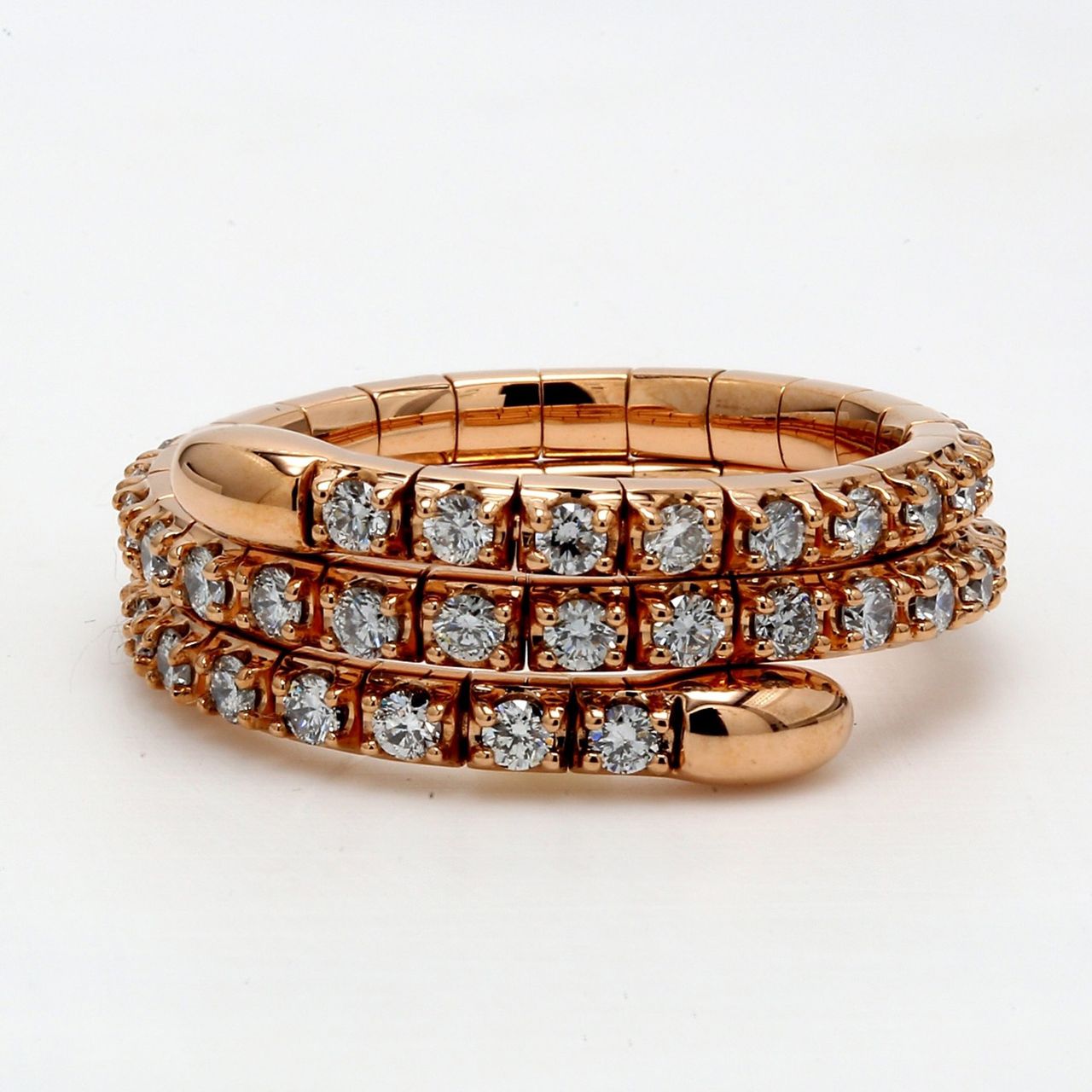Flexible eternity tri-band style in 18K gold with pre-set round diamonds.  D1.07ct.t.w.