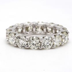 Eternity band in platinum with shared U-prong set (15) round diamonds.  D4.59ct.t.w.  Size 6