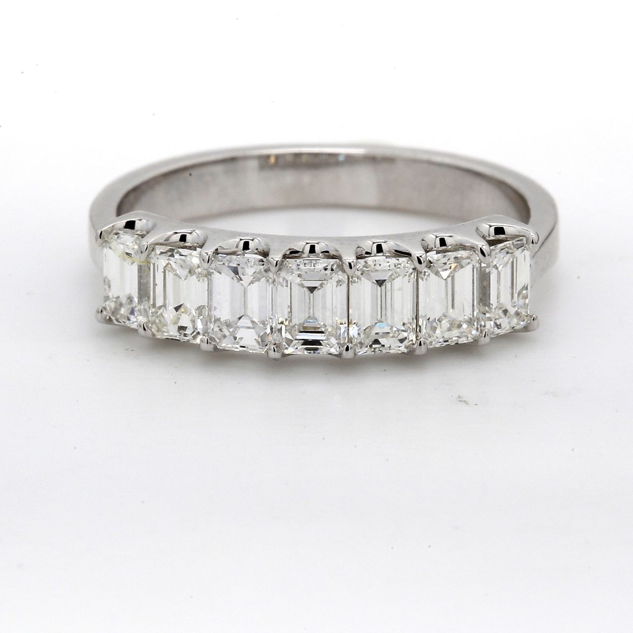 7-stone band in platinum with U-prong set emerald cut diamonds.  D1.32ct.t.w.  Size 6.75