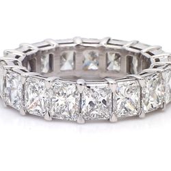 Eternity band in platinum with basket claw set D-G/VS2-SI1 (17) radiant cut diamonds.  D7.00ct.t.w.  Size 5.75
