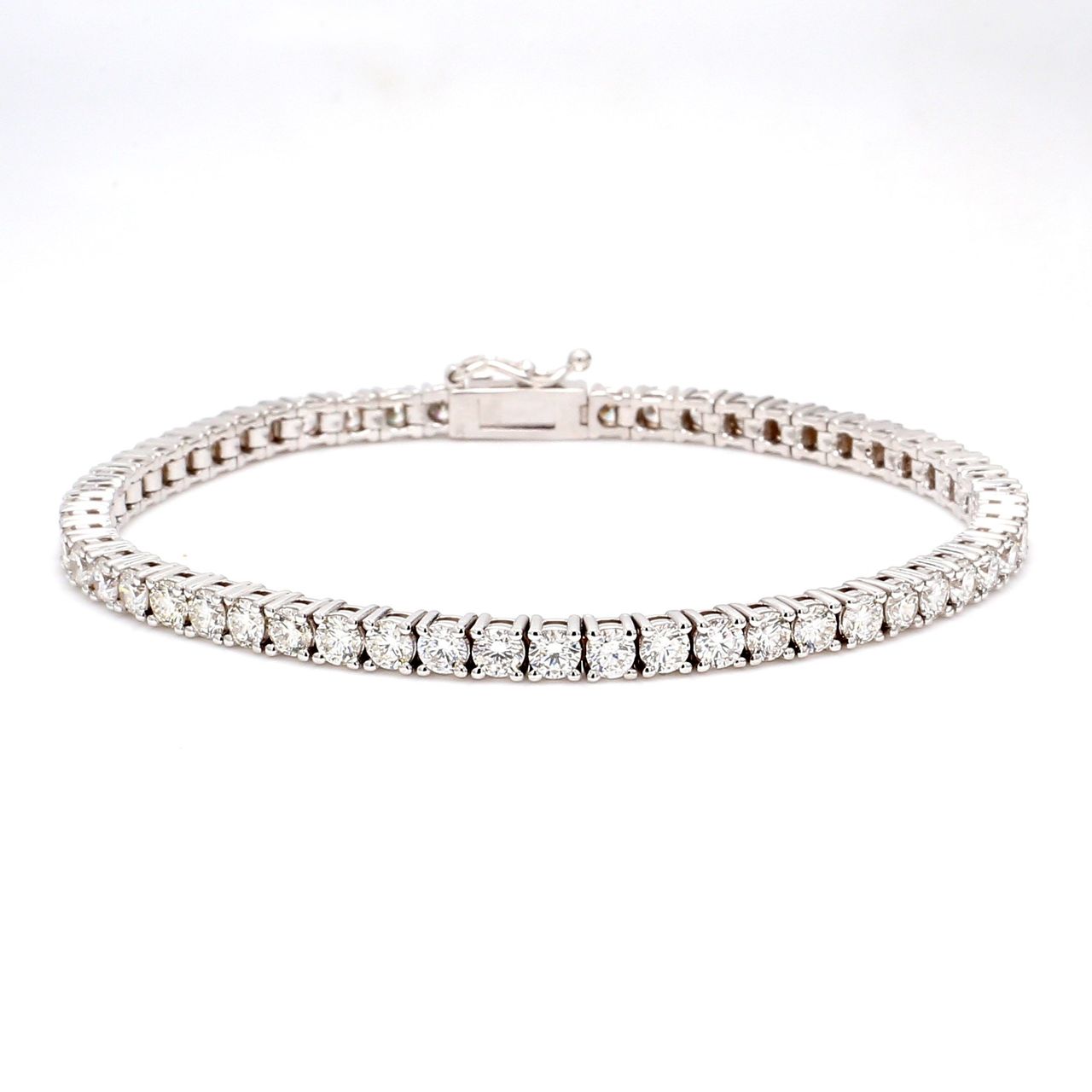 7' Tennis bracelet in 18K WG with 4-prong set (55) round diamonds.  D6.05ct.t.w.