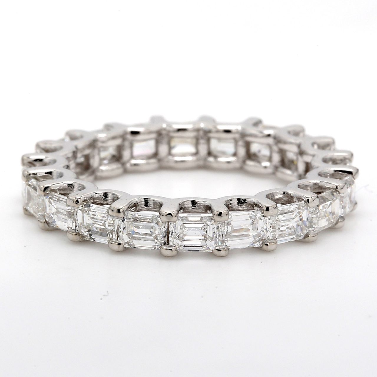 East to west style eternity band with U-prong set (21) emerald cut diamonds.  D1.98ct.t.w.  Size 6