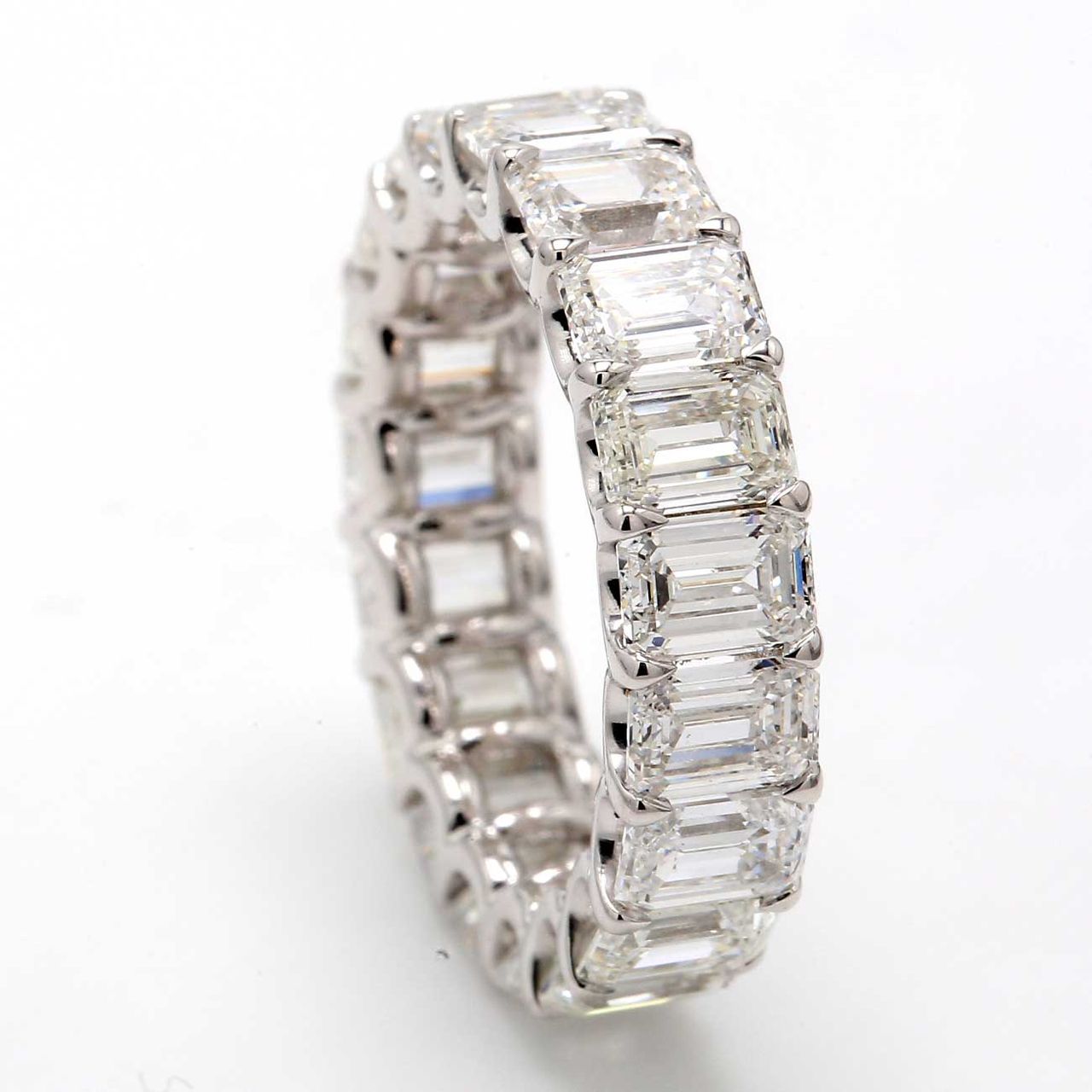 Eternity band with shared U-prong set (19) emerald cut diamonds.  D5.79ct.t.w.  Size 4.5