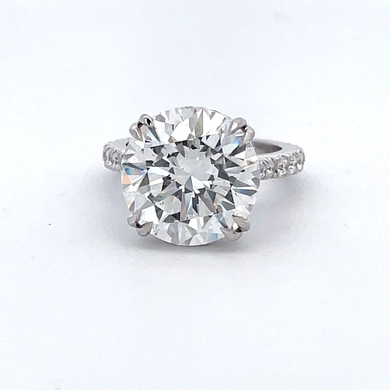 Hidden halo semi-mount in platinum with prong set round diamonds.  D0.77ct.t.w.