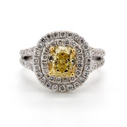 Double halo split-shank ring in 18K WG with 4-prong set GIA certified FY/VS2 cushion cut center & prong set round diamonds.  D2.43ct.t.w.  (Center 1.56ct.)