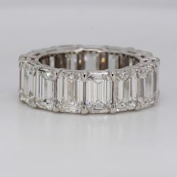 Eternity band in platinum with basket eagle claw set GIA certified E-G/VVS-VS (15) emerald cut diamonds.  D11.02ct.t.w.  Size 6.5