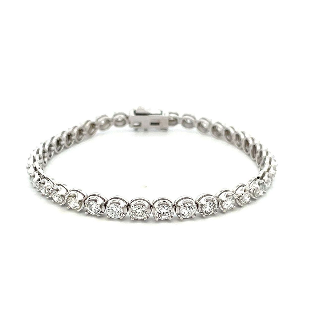 Tennis bracelet with illusion set (37) round diamonds.  D5.49ct.t.w.