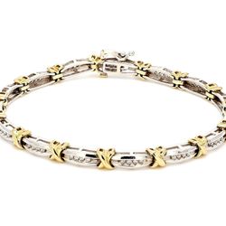 7' Bracelet 10K two-tone with channel set round diamonds.  D0.30ct.t.w.