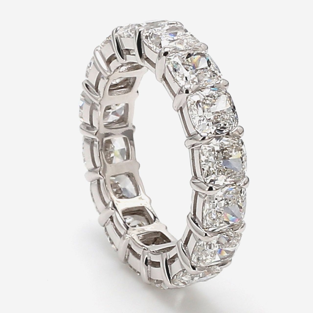 Eternity band in platinum w/ claw prong set GIA certified E-G/SI1 (16) cushion cut diamonds.  D8.52ct.t.w.  Size 7.5