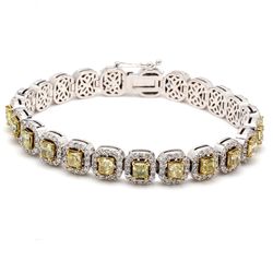 7' Halo tennis bracelet in 18K WG with pre-set rounds around 4-prong set fancy yellow (23) cushion diamond centers.  D10.15ct.t.w.  (Center 6.74ct.t.w.)