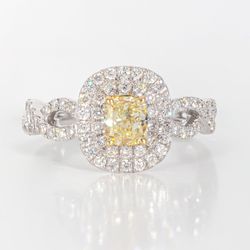 Double halo criss cross shank ring in 18K WG with rounds around a FY cushion cut diamond center stone.  D1.16ct.t.w.  (Center 0.58ct.)  Size 6.75