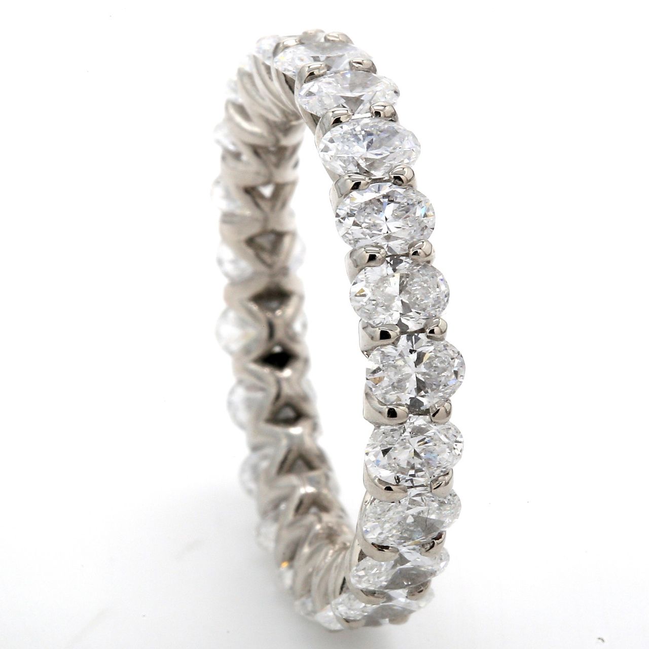 Eternity band in platinum with U-prong set (23) oval diamonds.  D3.33ct.t.w.  Size 6.5