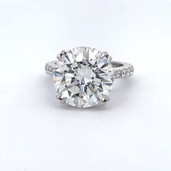 Hidden halo semi-mount in platinum with prong set round diamonds.  D0.77ct.t.w.