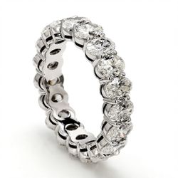 Eternity band in platinum with shared prong set (19) oval diamonds.  D3.80ct.t.w.