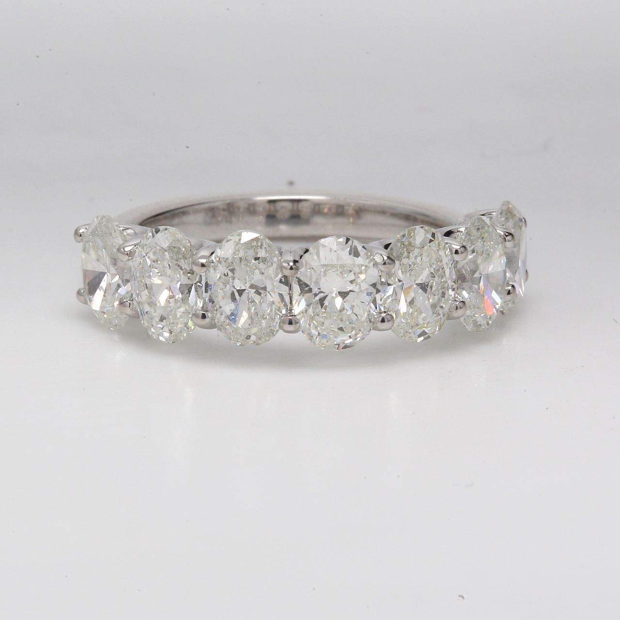7-stone band with U-prong set GIA certified G-H /SI1-SI2 oval diamonds.  D3.51ct.t.w.  Size 6.75