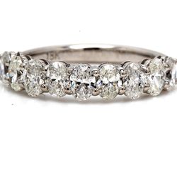 9-stone band in 18K WG with basket prong set oval cut diamonds.  D1.20ct.t.w.  Size 5