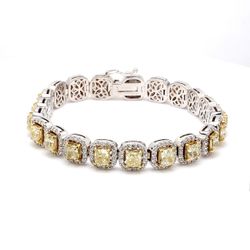 7' Halo tennis bracelet in 18K WG with prong set rounds around and 4-prong set fancy yellow cushion diamond centers.  D14.75ct.t.w.