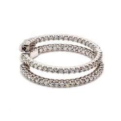 1.25' Inside out hoop earrings with U-prong set (74) round diamonds & with special spring lock.  D1.62ct.t.w.