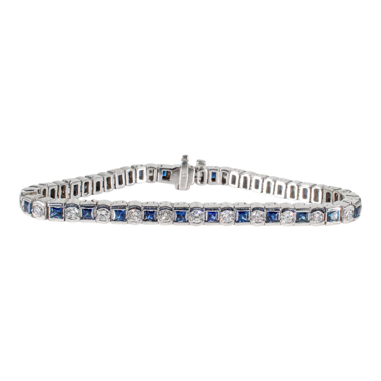 7' Tennis bracelet in white gold with alternating round diamonds & princess cut sapphires.  D2.35ct.t.w.  Sapphires 3.35ct.t.w.