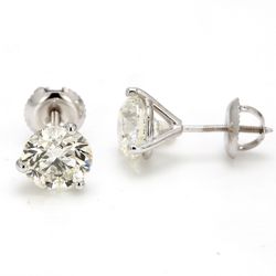 Screw back martini style stud earrings with 3-prong set round diamonds.  D3.01ct.t.w.