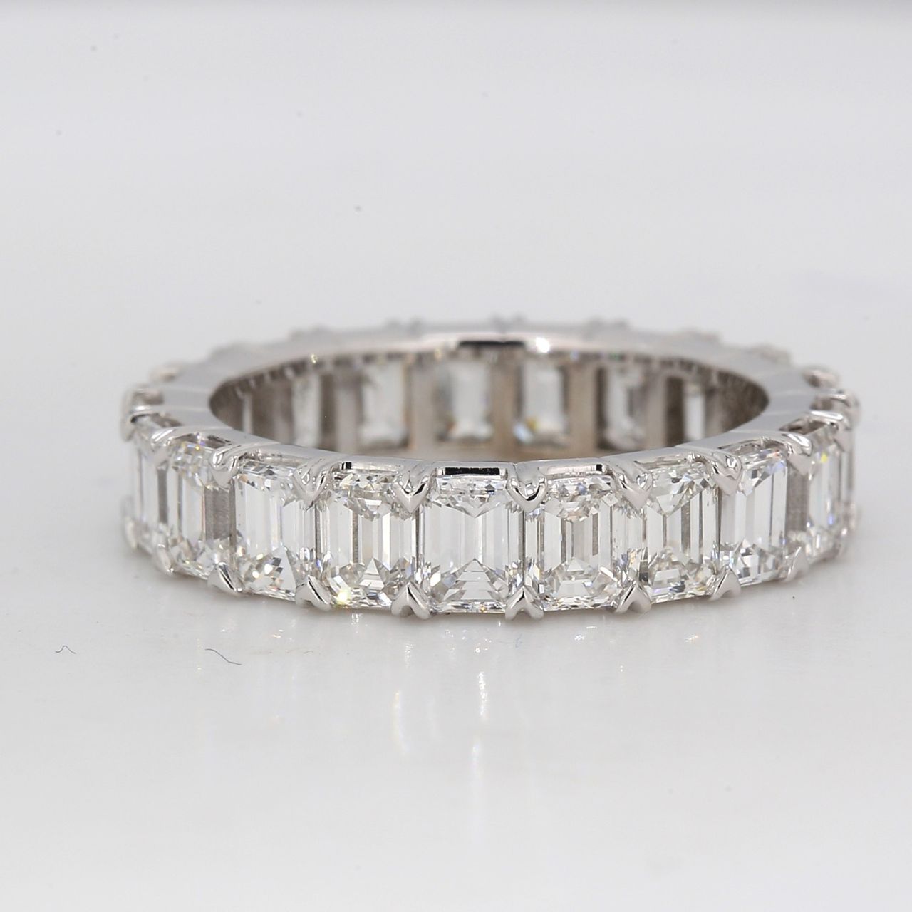 Eternity band in platinum with shared prong basket set emerald cut diamonds.  D4.90ct.t.w.  Size 5.5