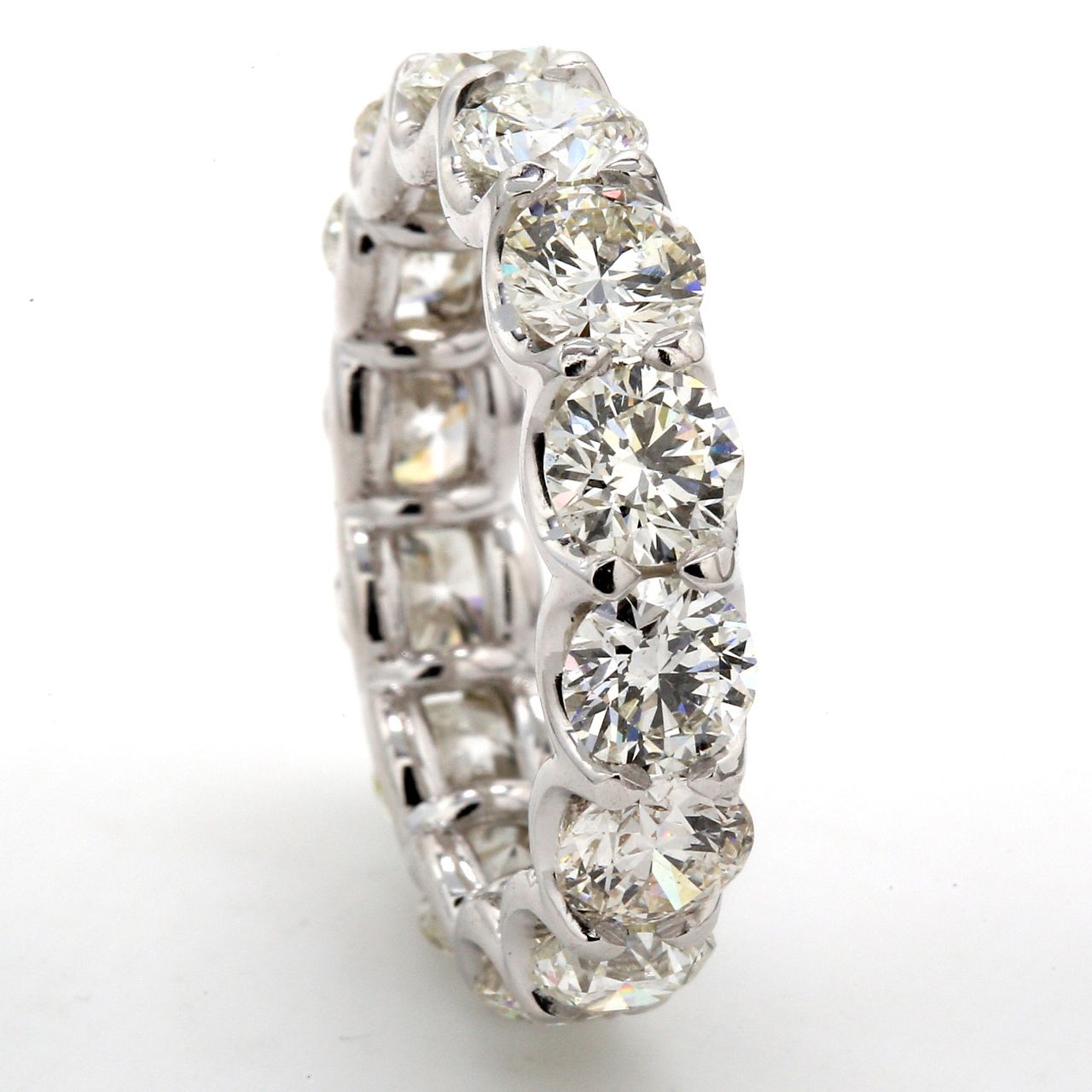 Eternity band in platinum with U-shape eagle claw set (14) round diamonds.  D5.62ct.t.w.  Size 6.25