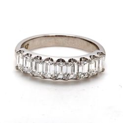 9-stone band in platinum with U-prong set emerald cut diamonds.  D1.24ct.t.w.  Size 6