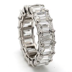 Eternity band in platinum with U-prong seet GIA certified H/VVS1-VS2 (17) emerald cut diamonds.  D9.21ct.t.w.  Size 6