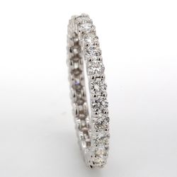 Eternity band in 18K WG with U-prong set (26) round diamonds.  D1.15ct.t.w.  Size 5