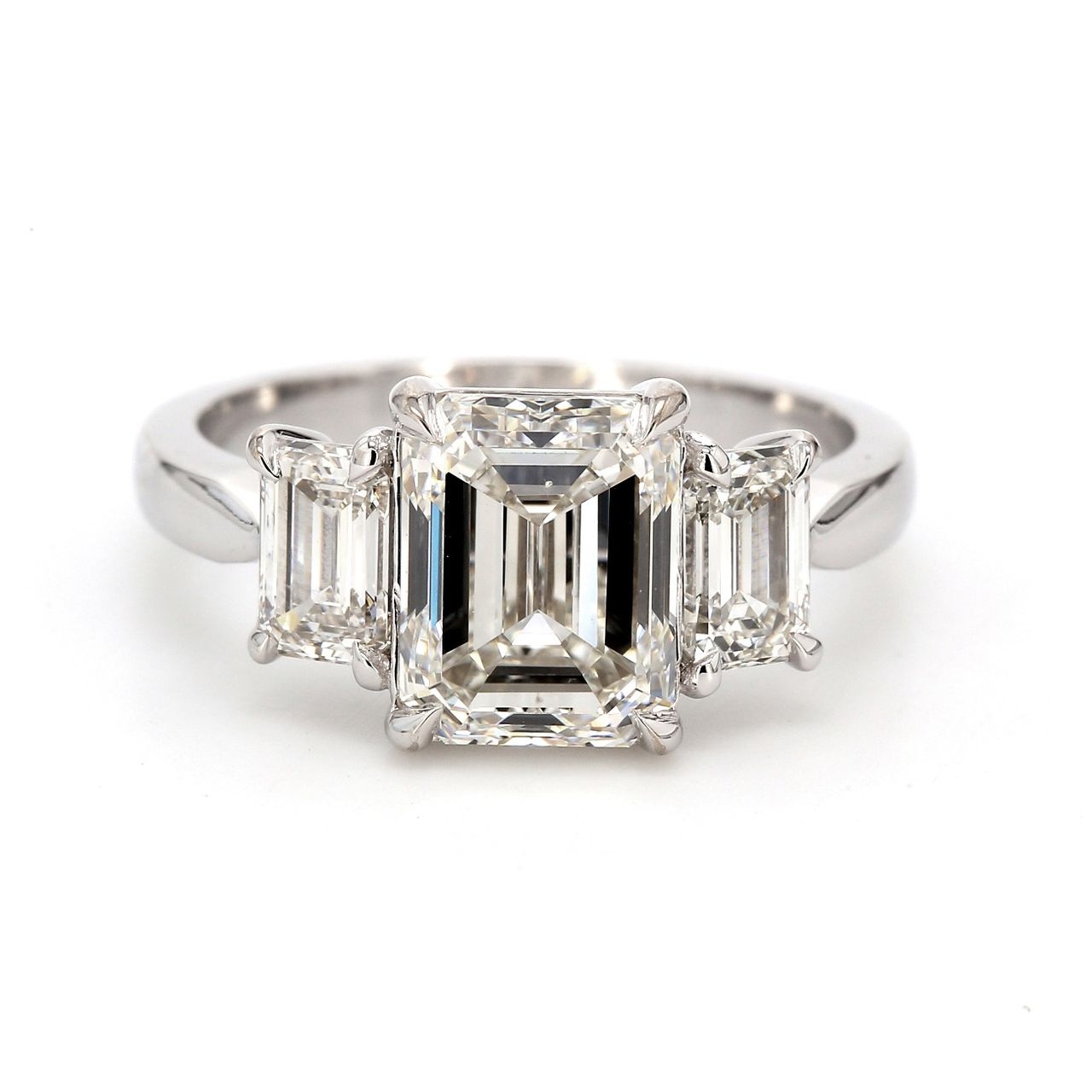 3-stone semi-mount in platinum with GIA certified I/VS1-VS2 emerald cut diamond sides.  D1.01ct.t.w.  Size 6.25