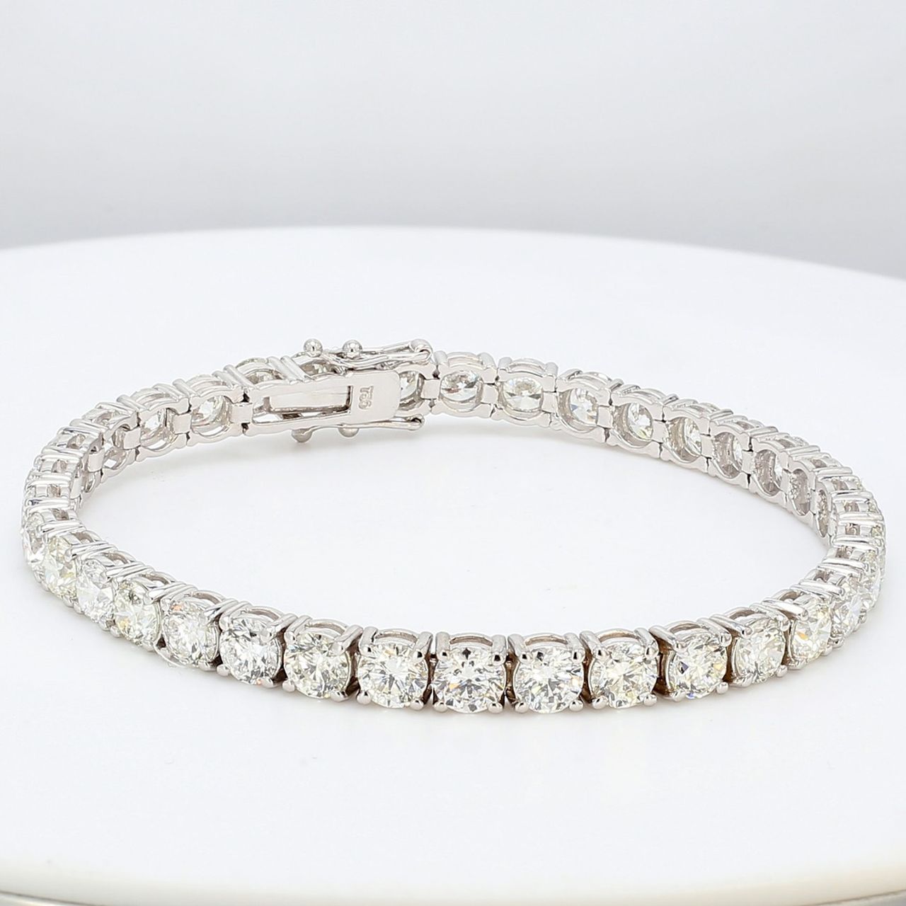 7' Tennis bracelet in 18K WG with prong set (36) round diamonds.  D14.61ct.t.w.