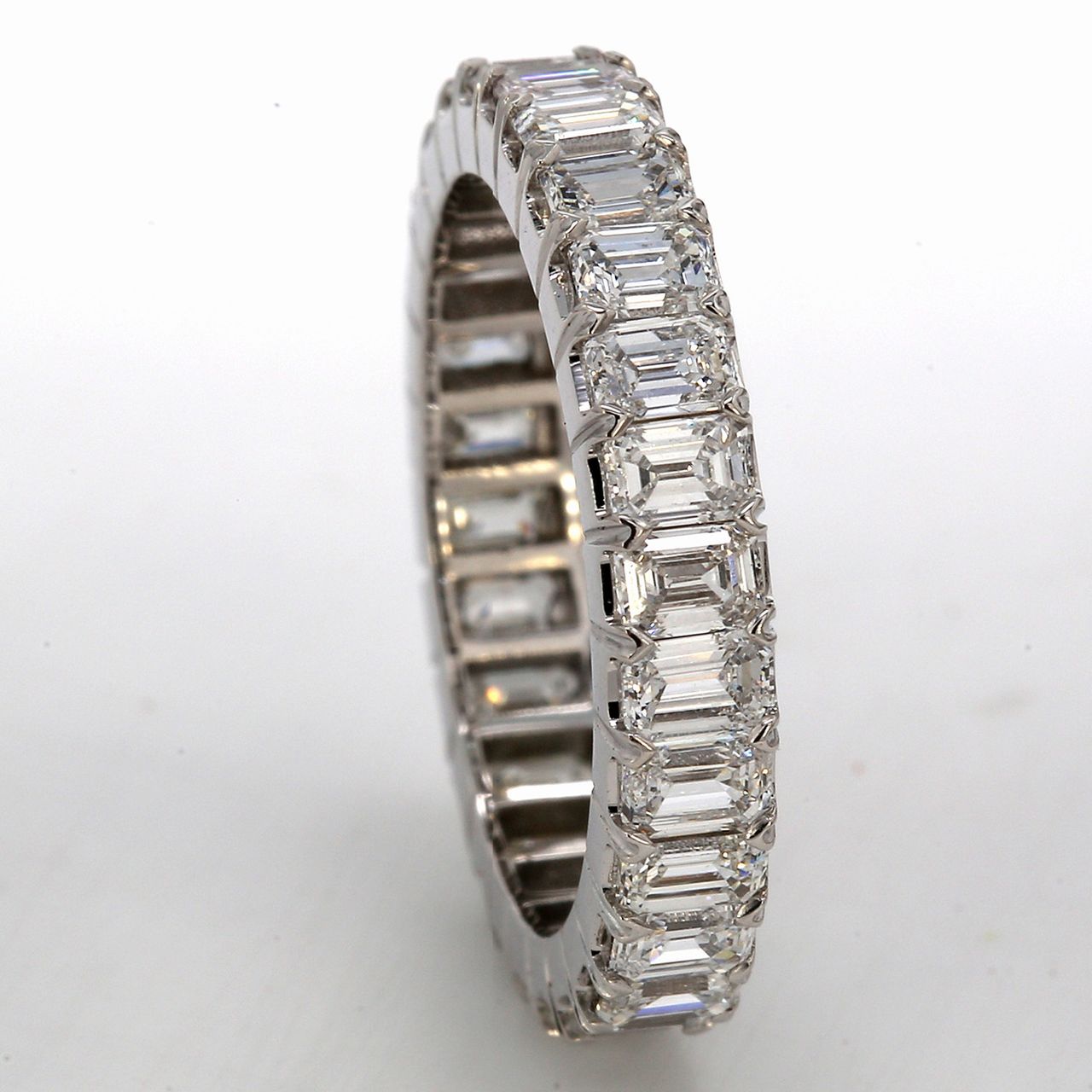 Eternity band in 18K WG with prong set (28) emerald cut diamonds.  D2.83ct.t.w.  Size 5.25