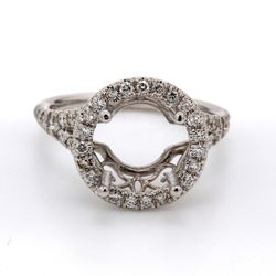 Halo split shank semi mount in18K WG with U-prong set round diamonds.  D0.58ct.t.w.