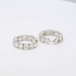 5/8' Inside out hoop earrings with shared prong basket set round diamonds.  D5.33ct.t.w.
