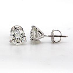 Screw back stud earrings with 3-prong set H/SI1 round diamonds.  D4.04ct.t.w.
