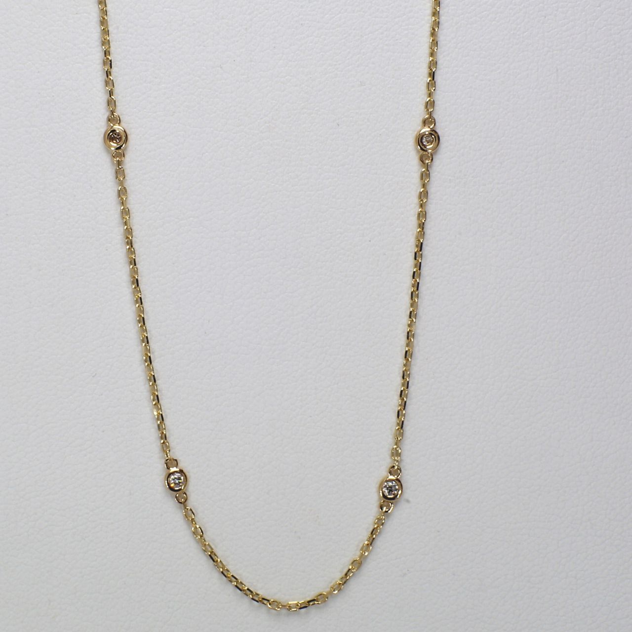 18' Diamonds by the yard necklace in yellow gold with bezel set (10) round diamonds.  D0.49ct.t.w.