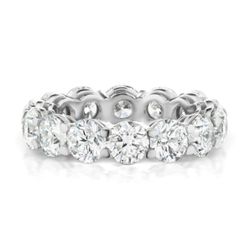 Eternity band in platinum with shared prong set GIA certified I/SI1 (14) round diamonds.  D7.11ct.t.w.  Size 7