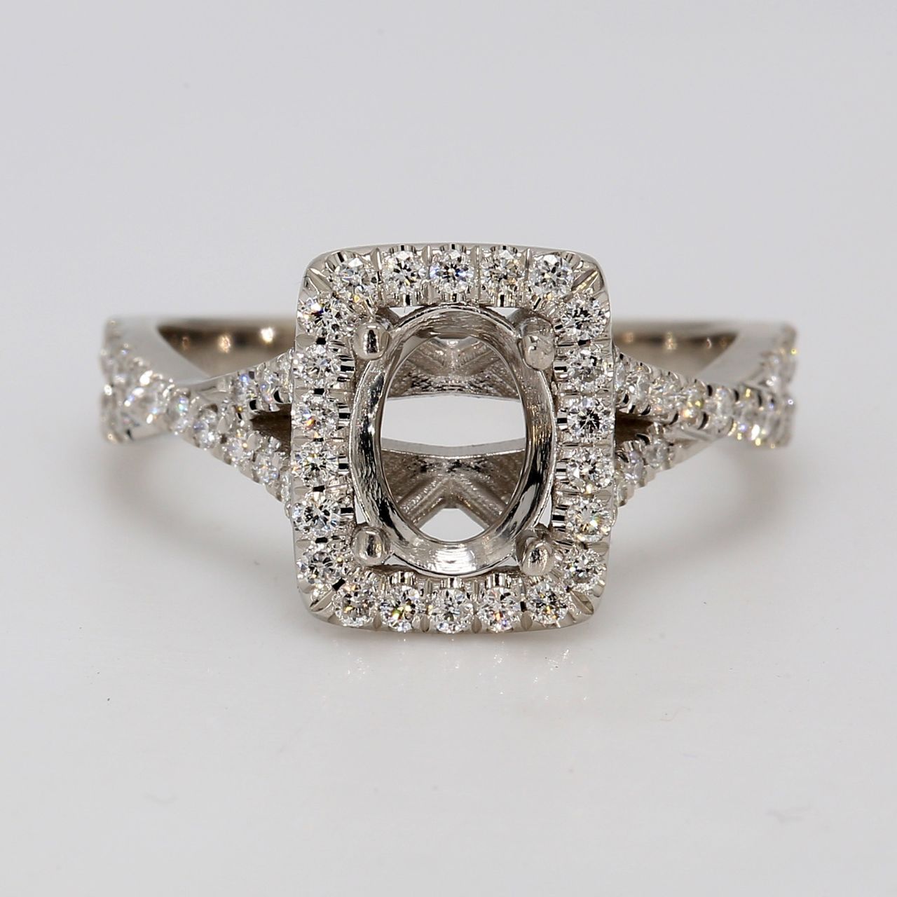 Halo semi-mount in platinum with pave set round diamonds.  D0.46ct.t.w.  Size 7