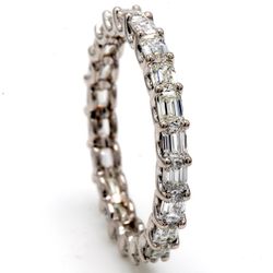 Eternity band east to west style in 18K WG with U-prong set (23) emerald cut diamonds.  D2.00ct.t.w.  Size 7