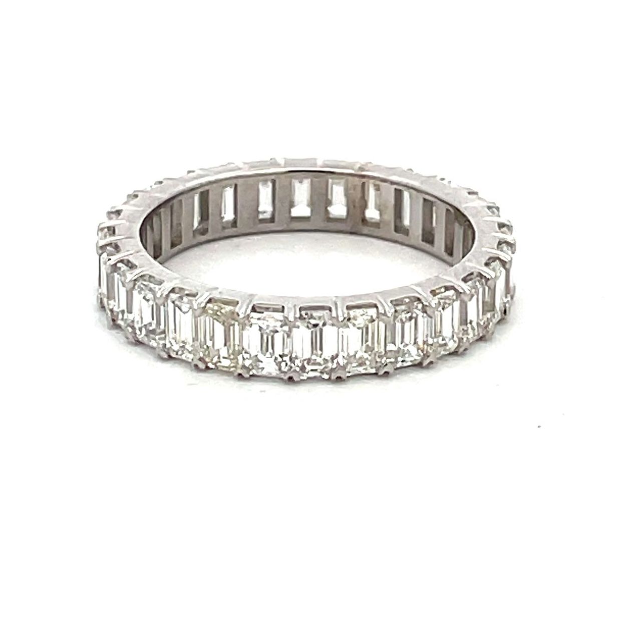 Eternity band in platinum with prong set (28) emerald cut diamonds.  D2.83ct.t.w.  Size 6