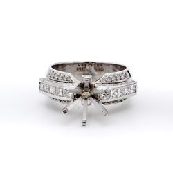 Semi-mount in 18K WG with princess cuts on top & round diamonds on the shank.  D1.05ct.t.w.