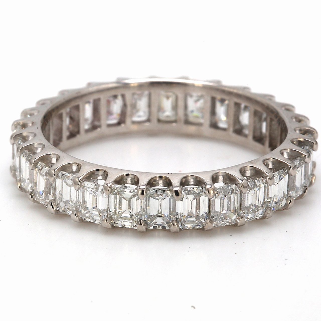 Eternity band in platinum with U-prong set (28) emerald cut diamonds.  D3.14ct.t.w.  Size 7