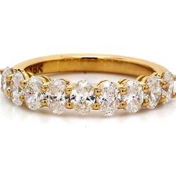 9-stone band in 18K YG with basket prong set oval cut diamonds.  D1.23ct.t.w.  Size 5.25