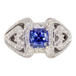 Antique style ring in 18K WG with pave set round diamonds and 4-prong set tanzanite center stone.  D0.61ct.t.w.  Tanzanite 1.65ct.