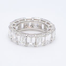 Eternity band in platinum with shared prong set emerald cut diamonds.  D8.79ct.t.w.