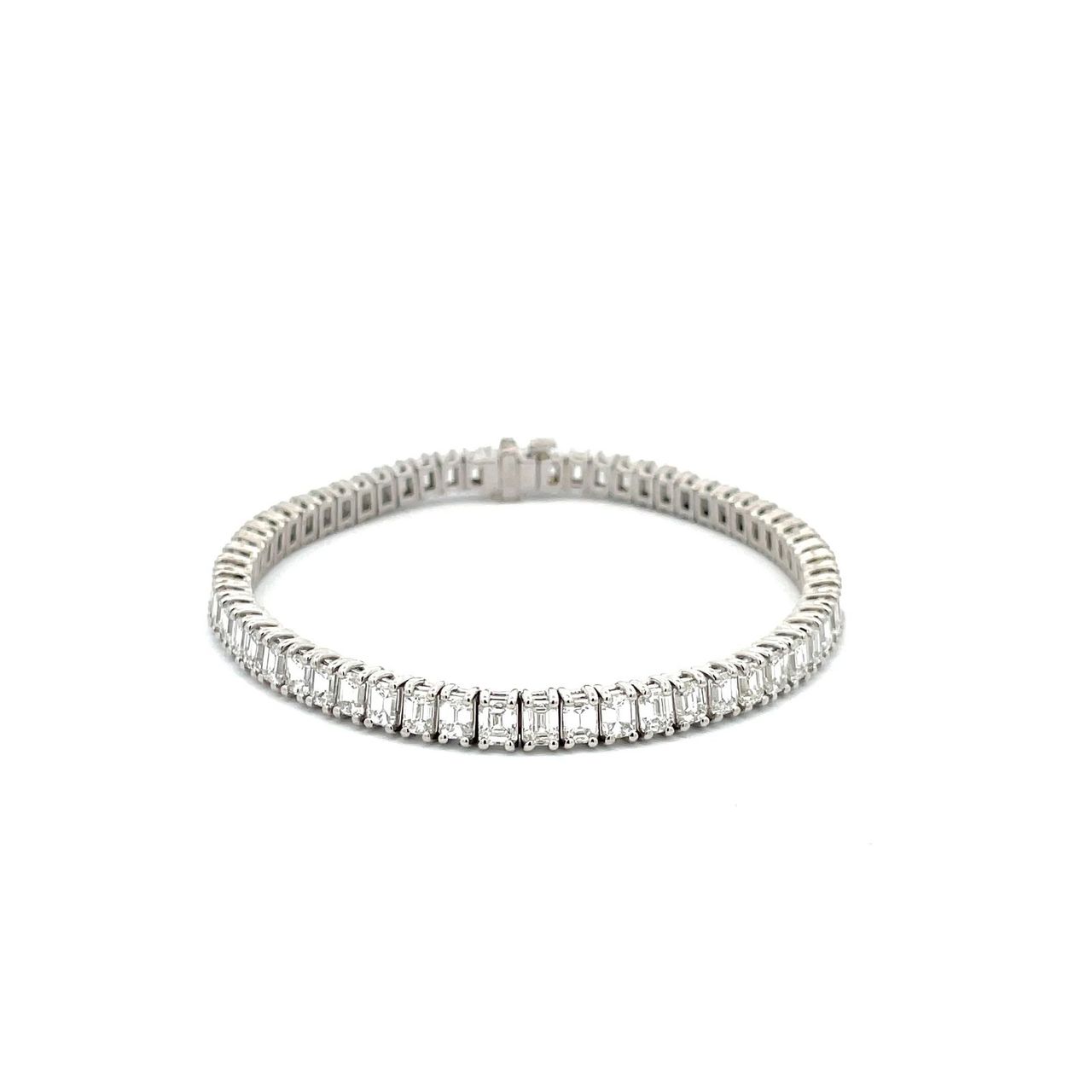 7' Tennis bracelet in platinum with basket prong set (60) emerald cut diamonds.  D11.05ct.t.w.