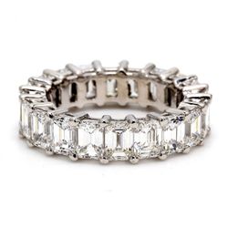 Eternity band in platinum with shared prong set (19) emerald cut diamonds.  D5.84ct.t.w.  Size 5