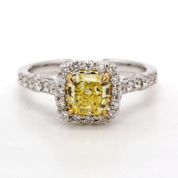 Halo fleur-de-lis style ring in 18K WG with French pave set rounds around 4-prong set GIA certified FIY/I1 radiant diamond centerstone.  D1.50ct.t.w.  (Center 1.02ct.)